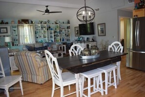 Cozy living space with a dining area, comfortable seating, and a kitchen.