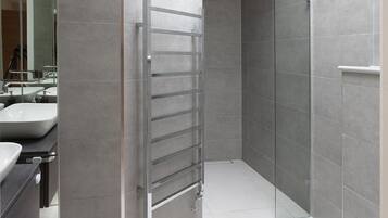 Bathtub, hair dryer, towels, soap