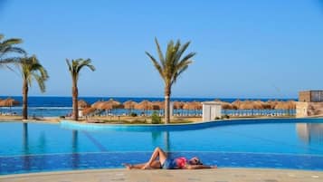 5 outdoor pools, open 9:00 AM to 6:00 PM, pool umbrellas, sun loungers