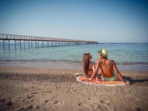 Private beach, beach umbrellas, beach towels, beach volleyball
