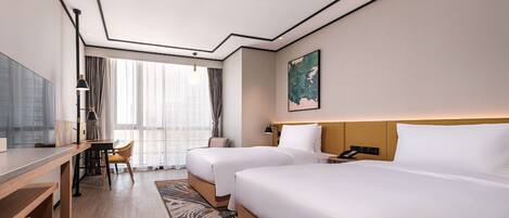 A hotel room with two beds, a desk, a chair, a TV, and a large window with curtains.