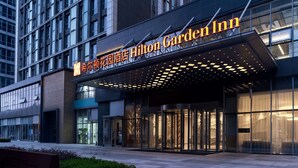 A modern hotel entrance with a prominent sign reading "Hilton Garden Inn." - Hilton Garden Inn Hefei Binhu New District (Hefei)