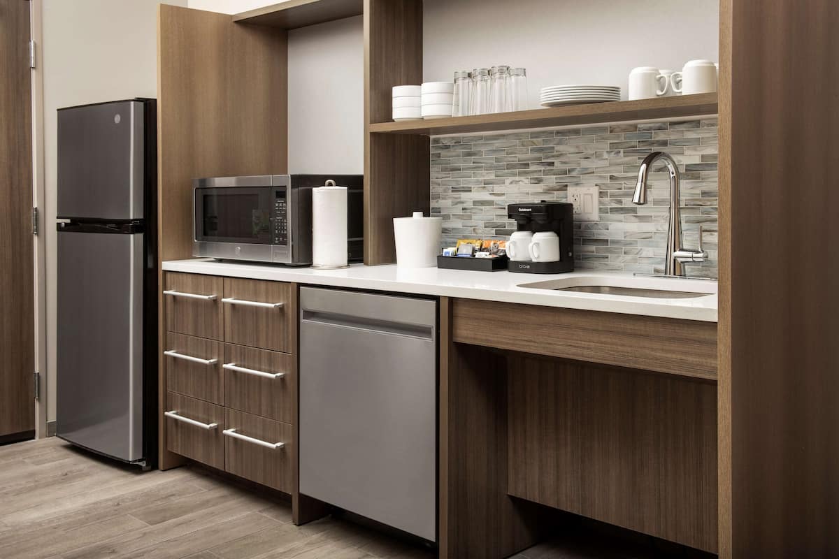 full-sized fridge, microwave, dishwasher, coffee/tea maker