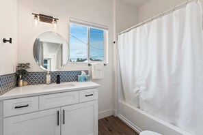 Bathtub, hair dryer, towels, shampoo - City Close, Vibe High | Your Group’s New Go-To (Spokane)