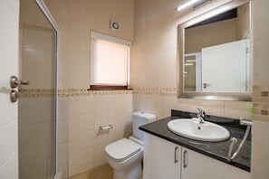 A bathroom with a toilet, sink, and shower. - San Lameer Villa Rentals 2851 (Southbroom)