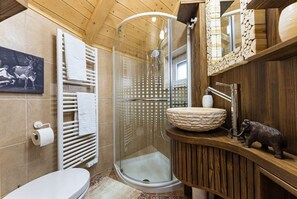 Shower, hair dryer, slippers, towels