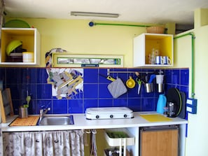 Fridge, stovetop, electric kettle, cookware/dishes/utensils