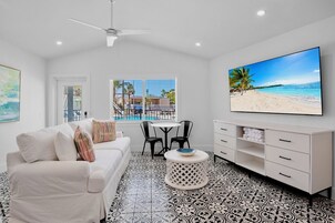 Deluxe King Room | Living area | 55-inch Smart TV with digital channels, TV