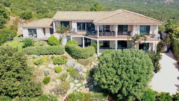 A two-story house with a tiled roof, large windows, and a balcony. - Maremuntagna lux. villa sea view 7 bed swim. pool 10min city (Porto-Vecchio)