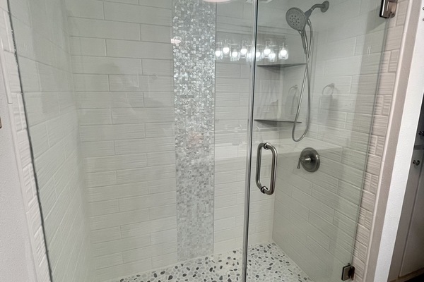 Combined shower/tub, hair dryer, towels, soap