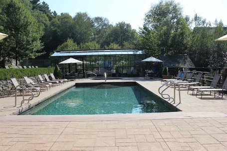 Outdoor pool, a heated pool. Beautiful Condominium at Castle Hill Resort, 10 Minutes from Okemo Ski Resort