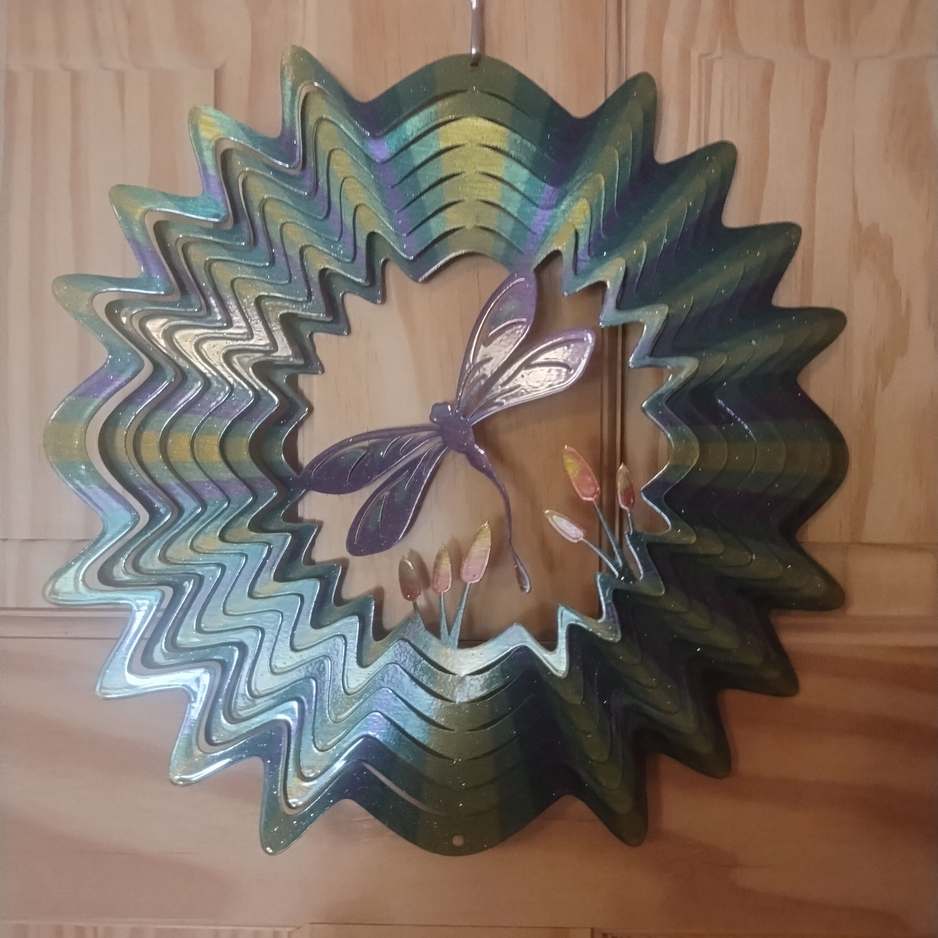 A decorative glass piece with a butterfly design.