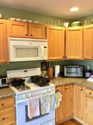 Fridge, microwave, high chair, dining tables