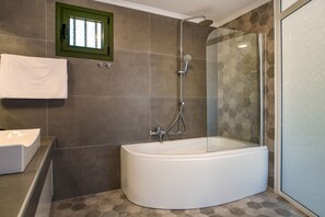 Bathtub, hair dryer, towels, soap