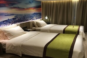 A hotel room with two beds, a cityscape mural on the wall, a nightstand, and a lamp. - Atour Hotel (Shenzhen)