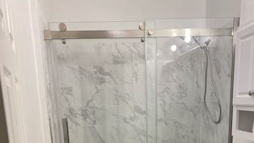 Combined shower/tub, towels, soap, toilet paper