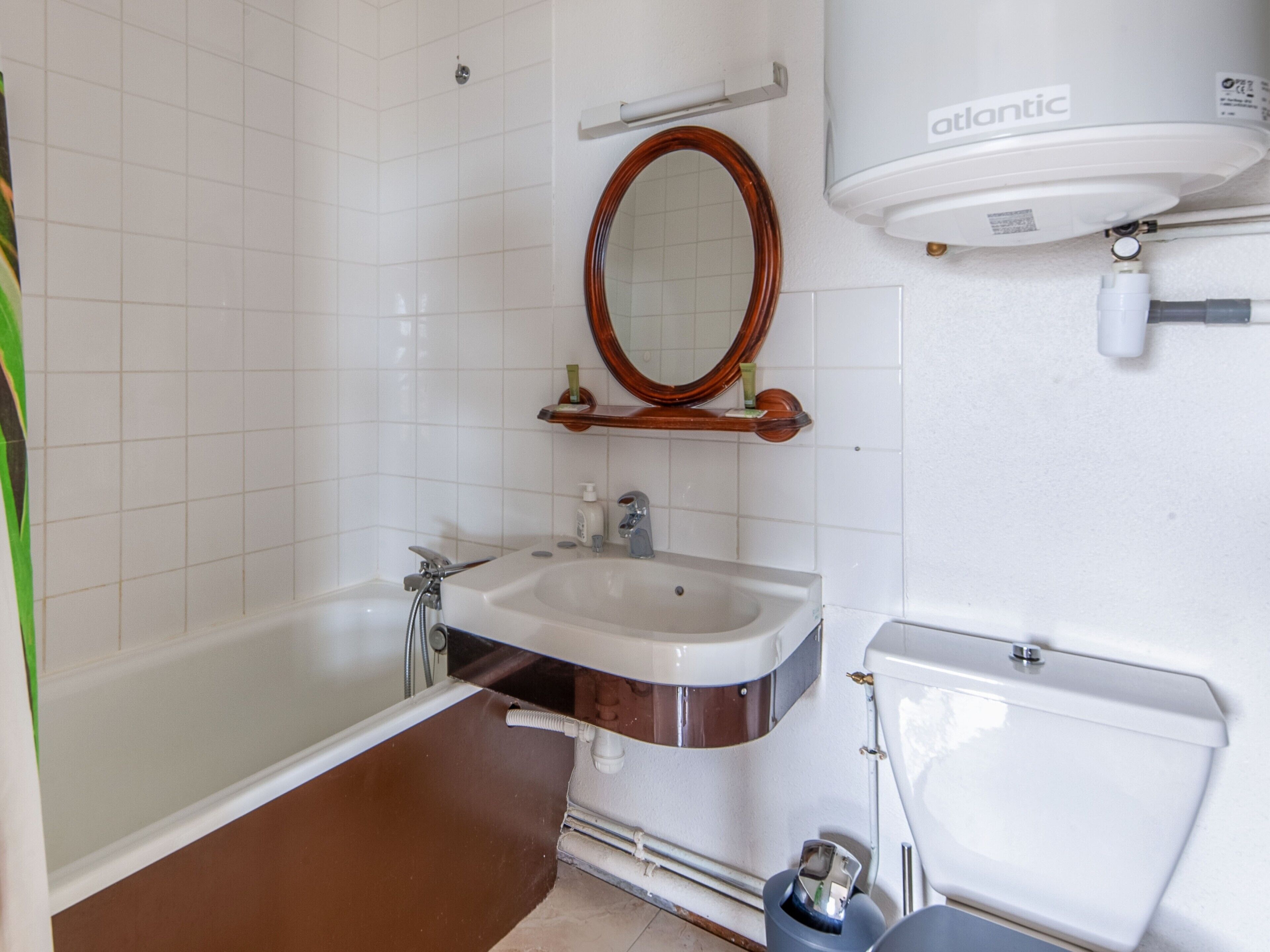 Bathtub, hair dryer, towels, soap