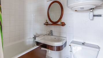 Bathtub, hair dryer, towels, soap
