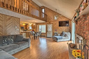 Relax in this cabin-style accommodation with a spacious living area, mezzanine level, and cozy fireplace.