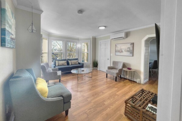 Condo (Ames for Fun) | Living area | 55-inch Smart TV with cable channels, TV, streaming services - Ames for Fun (Amesbury)