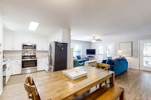 Enjoy a comfortable stay in this well-appointed apartment with a functional kitchen, dining area, and cozy living space.