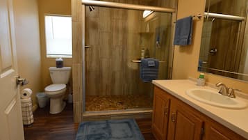 Combined shower/tub, hair dryer, towels, soap