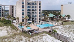 A hotel with multiple floors, a swimming pool, and a beach area. - 🦩Book Me Baby! Gulf View ~ It's The Treasure You Have Been looking For!🦩 (Fort Walton Beach)