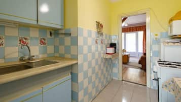 Fridge, microwave, cookware/dishes/utensils, dining tables