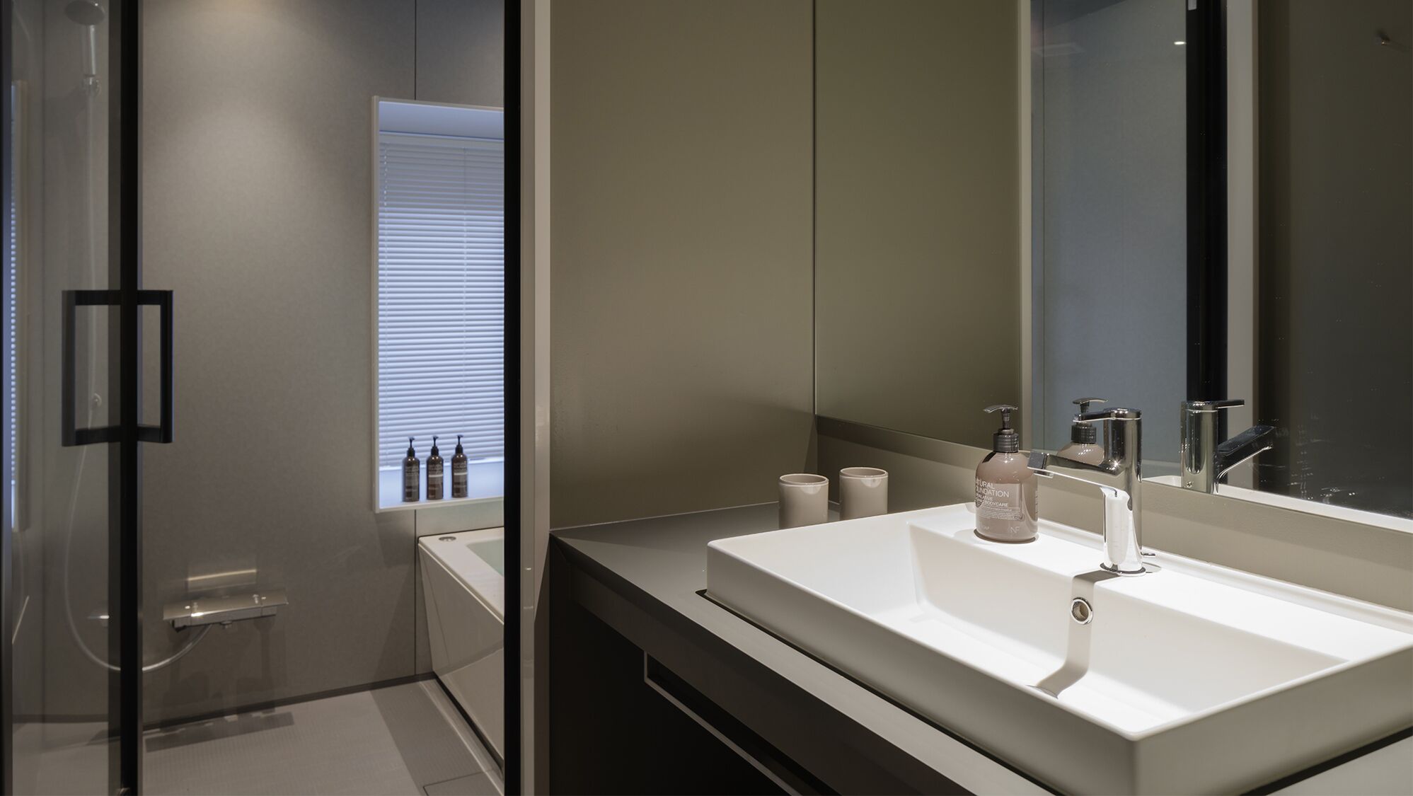 Bathroom | Separate bathtub and shower, free toiletries, hair dryer, slippers