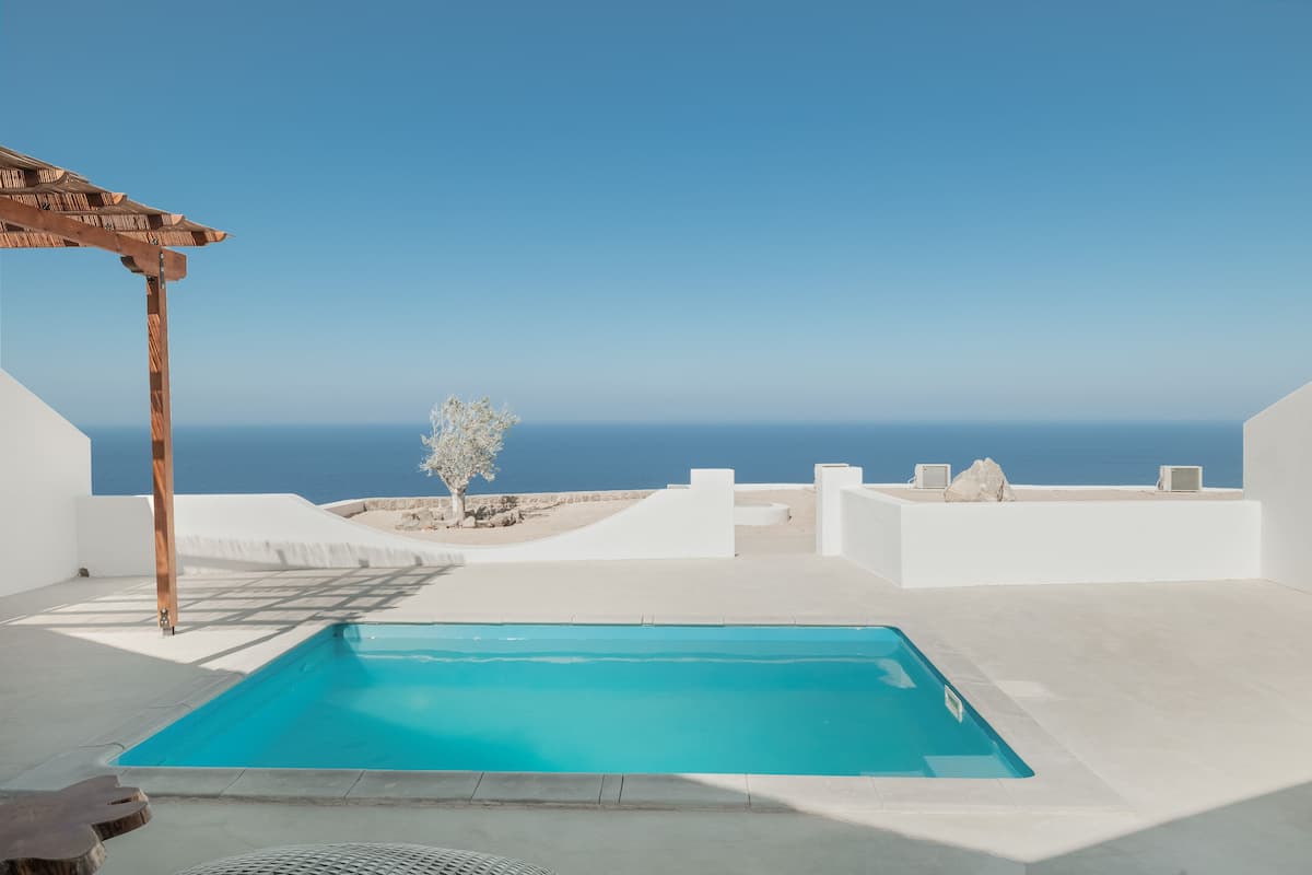 A rooftop pool with a clear view of the ocean.