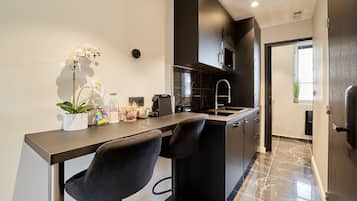 Fridge, microwave, stovetop, coffee/tea maker