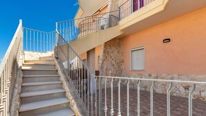 A staircase with metal railings leading to a balcony. - 1930 Residence La Primula (Manduria)