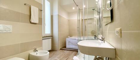 Exclusive Studio Suite | Bathroom | Hair dryer, bidet, towels, soap