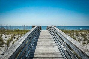 A wooden boardwalk leading to the beach with a clear view of the ocean. - Gulf Shores Surf & Racquet Club 212A (Gulf Shores)
