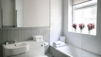 Combined shower/tub, towels, soap, toilet paper