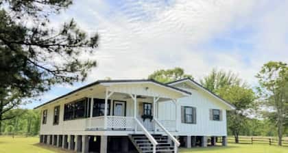 40 Acres 4 Bedroom 4 full bathroom Home with a Pond stocked with Fish & RV Port