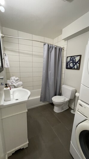 Combined shower/bathtub, hair dryer, towels, soap