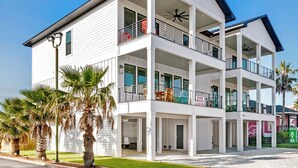 A multi-story building with balconies, a for rent sign, and an ATM on the ground floor. - 😎 Night Heron, East. ⭐️⭐️⭐️⭐️⭐️ 6BR. Heated Pool. Beachview. Gorgeous! (Gulf Shores)