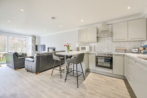 Villa | Private kitchen | Fridge, microwave, oven, stovetop