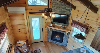 Luxury tiny cabin on the Valley River with mountain views.