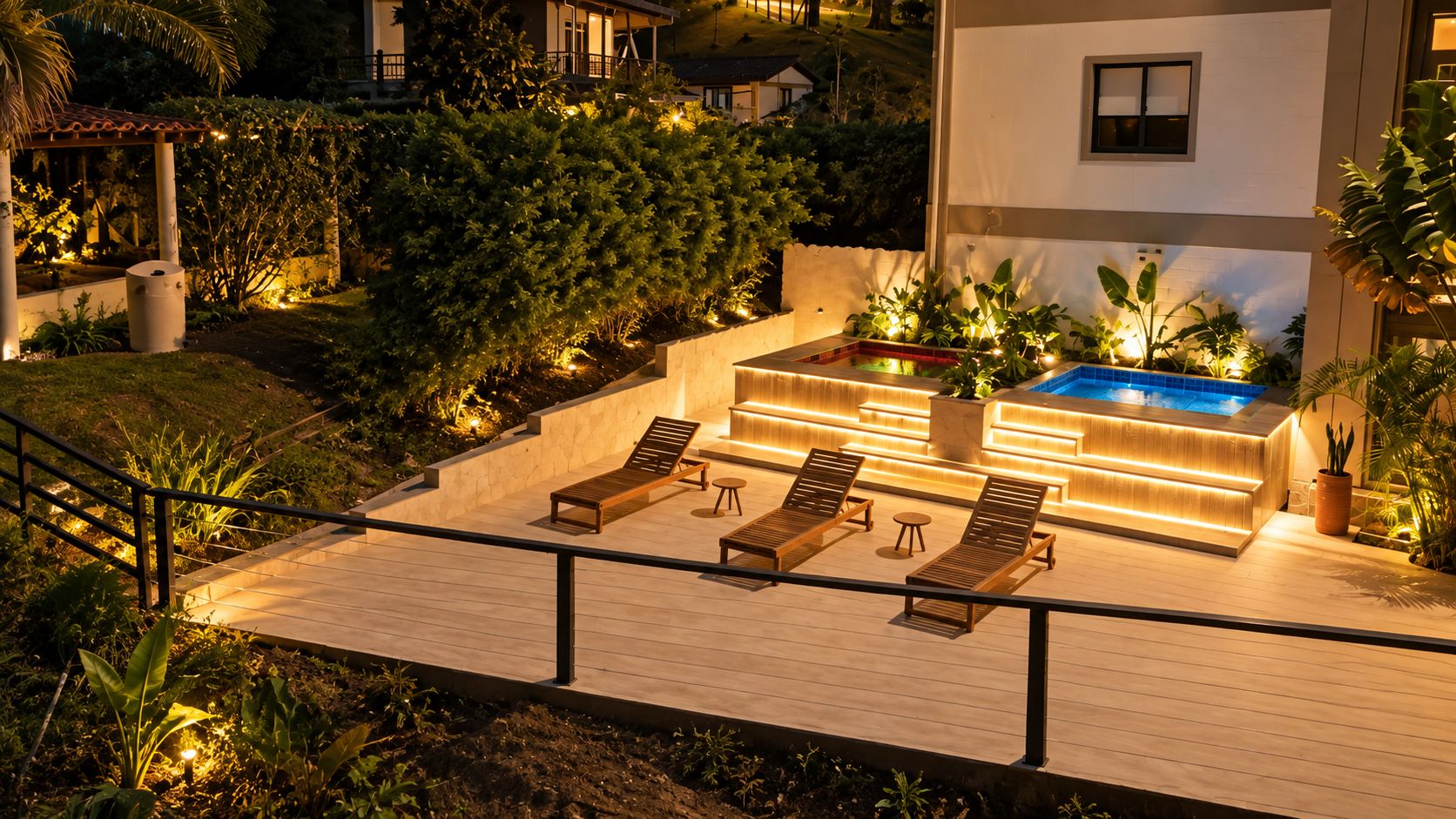 A rooftop pool area with lounge chairs and a hot tub.