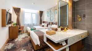 A hotel room with a large bed, a vanity with a mirror, a desk, and a large window with curtains. - James Joyce Coffetel Shanghai Zhuanqiao Wanda Plaza (ex Shanghai James Joyce Coffetel Zhuan Bridge W (Shanghai)
