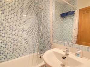 Bathtub, hair dryer, towels