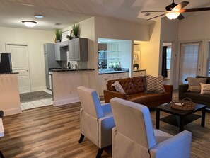 Relax in a comfortable living space with a central seating area, coffee table, and armchairs.