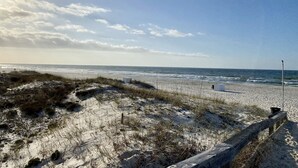 A beach with a wooden fence, sand dunes, and a clear sky. - Martinique! Luxury! Beach House on the Crescent with Golf Cart.  (Gulf Shores)
