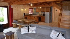 A wooden cabin interior with a kitchen, dining area, and living room. - WARM ALTITUDE BARN, Cambasque, 8 people (Cauterets)