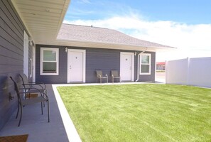 Enjoy a peaceful retreat with a porch and comfortable seating for relaxation.