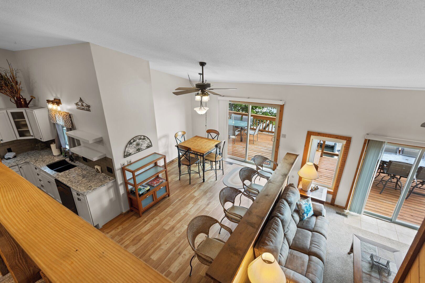 A spacious open-plan living area with a kitchen, dining table, and seating area.