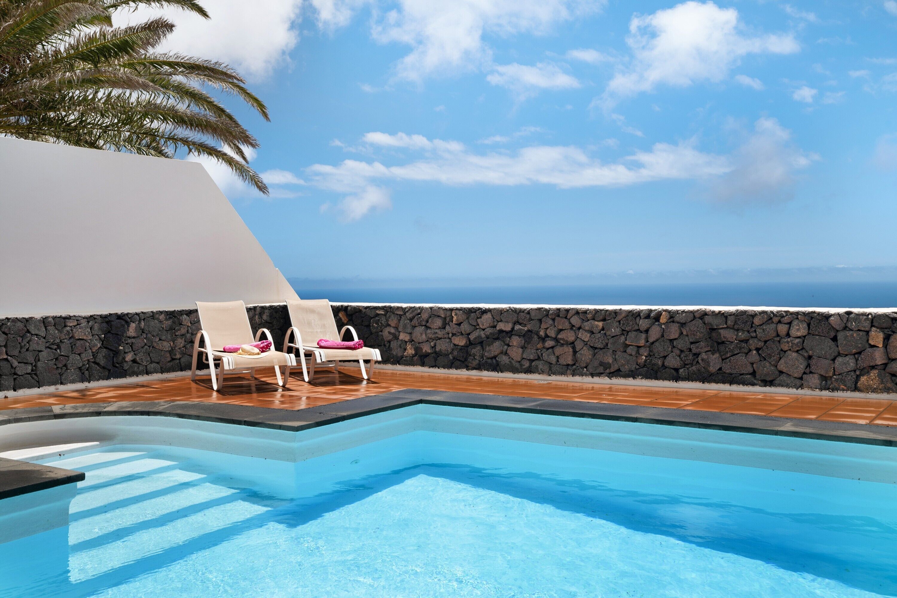 A heated pool, pool loungers