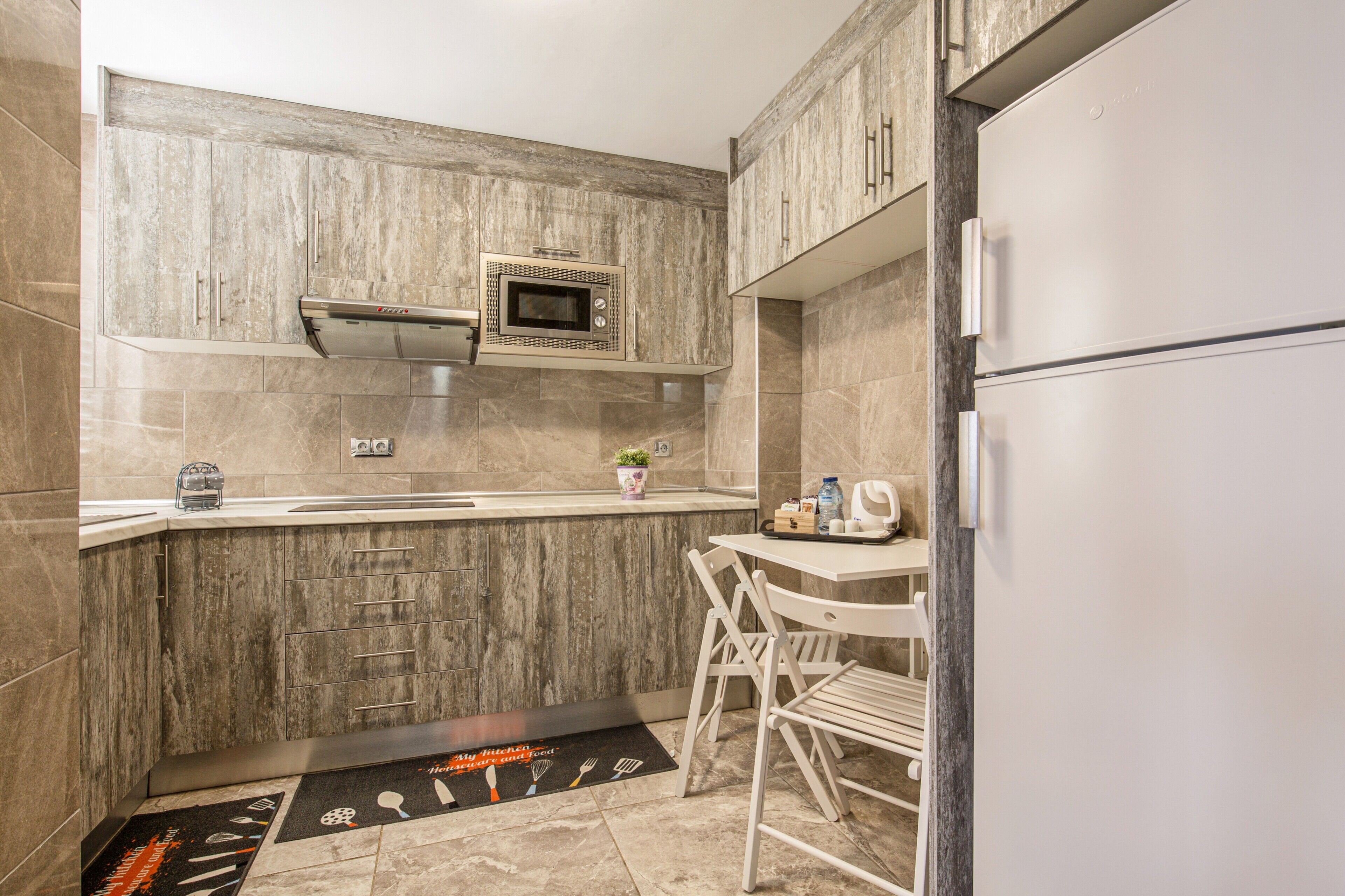 Fridge, microwave, stovetop, coffee/tea maker